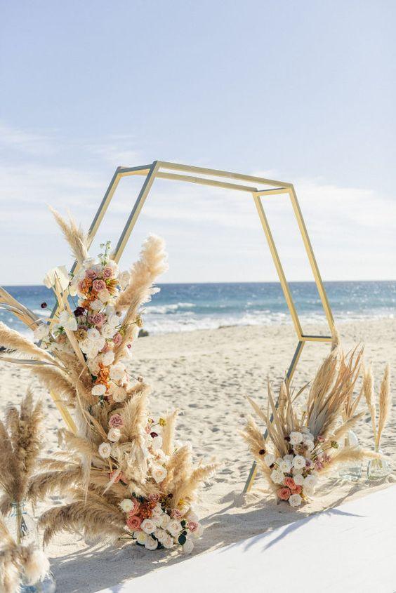 Top 20+ Romantic Beach Wedding Decor Ideas for Your Big Day Aliens tips Beach Wedding Decor Ideas, Romantic Beach Wedding, Starfish and Shells, Hanging Decorations, Bamboo Arch, Wooden Signs, Beach Umbrellas, Wooden Slice Centerpieces, Seashell Escort Cards, Driftwood Decor, Fairy Lights, Flower Garlands, Seaside-Inspired Favors, Beachy Escort Card Display, White Linens, Nautical Details, Seashell Bouquets, Wooden Benches, Sand-Filled Vases, Ocean-Inspired Invitations, Beachy Table Numbers, Sunset Serenade.